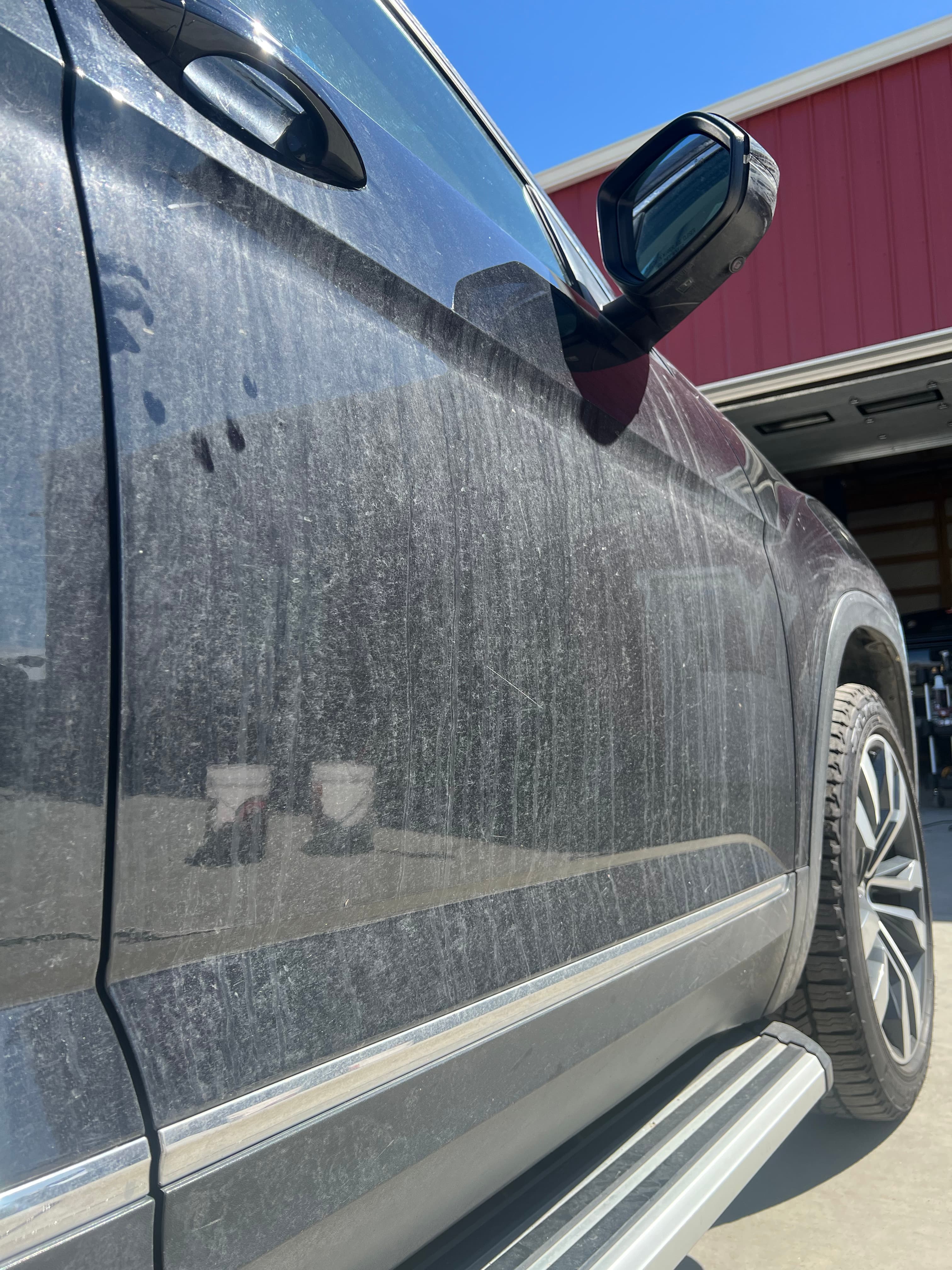 Before detailing - dirty SUV exterior with water spots and oxidation in Loveland, Colorado