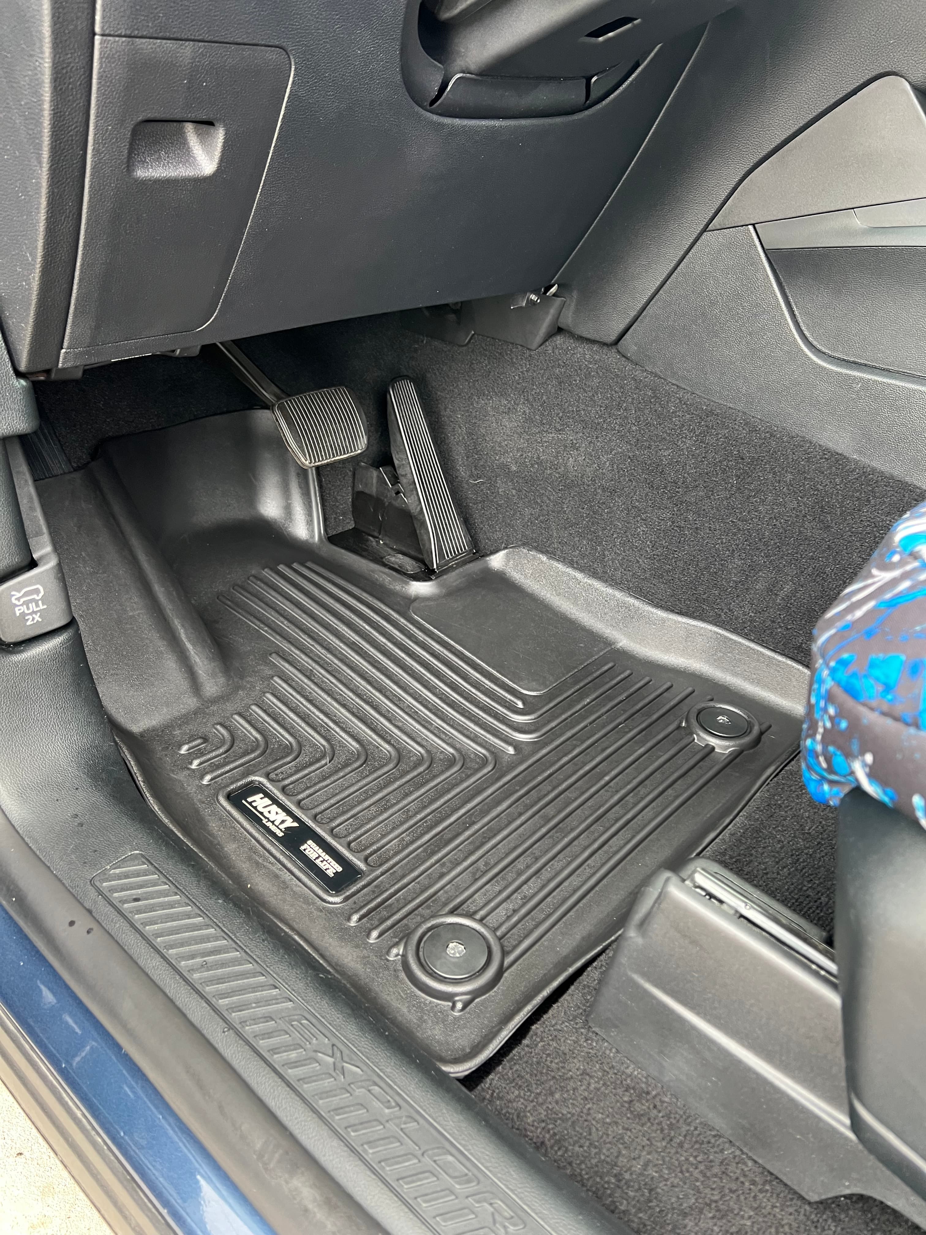 Before detailing - dirty car floor mats with mud, debris and grime in Loveland, Colorado